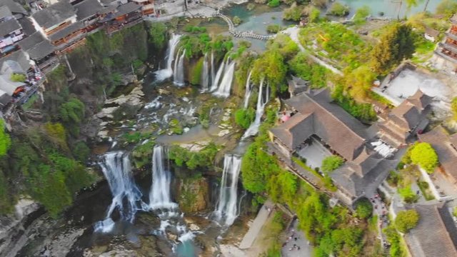Picturesque ancient town in Hunan province in China - Hibiscus town and its spectacular Furong Waterfall. (aerial photography)