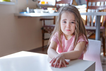 the child is bored, sad face. The girl is crying. The concept of childhood, children's day,...