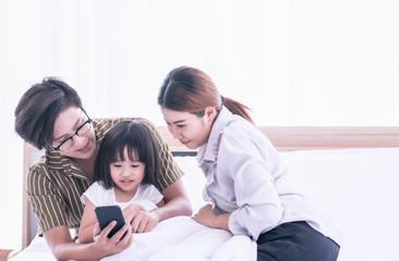 Parents helping their child to learn online