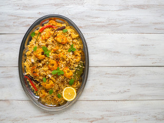 Pilaf with shrimp. Tasty and delicious prawns biryani, top view, copy space