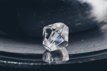 
faceted crystal bead on a silver background