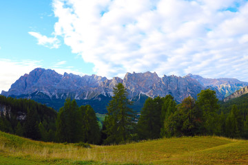 Fototapeta na wymiar Beautiful summer landscape, fantastic alpine pass and high mountains, Dolomites, Italy, Europe. Out of focus.