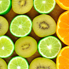 Fototapeta na wymiar Delicious fresh Gold Kiwifruit of New Zealand, Green background with citrus-fruit of lime and orange slices on white background, Lemon texture 