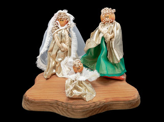 Christmas nativity scene decoration on wooden base on black background, handmade nativity scene...