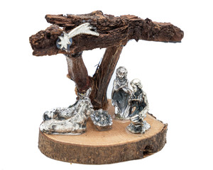 metallic and wooden nativity scene decoration on white background, Christmas decoration made of...