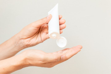 Young man hands using sanitizer gel. Stop covid-19 concept.