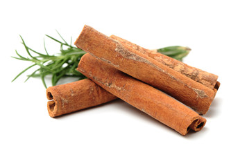Cinnamon and rosemary on a white background