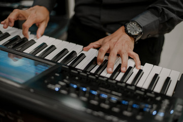 Hands playing piano jazz music