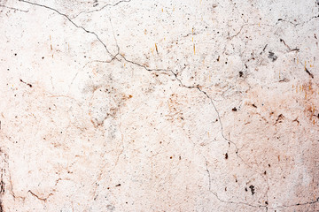 Texture of a concrete wall with cracks and scratches which can be used as a background