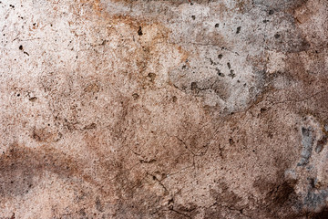Texture of a concrete wall with cracks and scratches which can be used as a background
