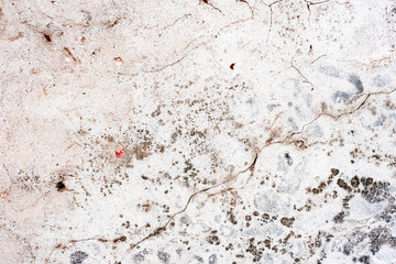 Texture of a concrete wall with cracks and scratches which can be used as a background