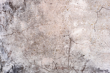 Texture of a concrete wall with cracks and scratches which can be used as a background