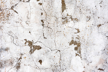 Texture of a concrete wall with cracks and scratches which can be used as a background