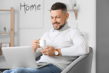 Handsome businessman working at home