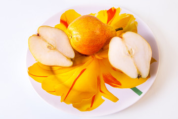 Fototapeta na wymiar chopped fresh pear in half on a plate