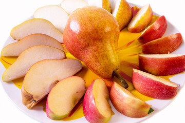fresh pear, orange, apple, sliced ​​on a plate