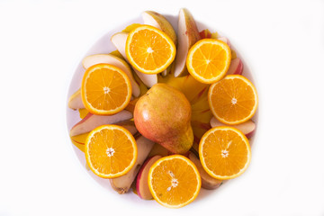 fresh pear, orange, apple, sliced ​​on a plate