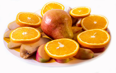 fresh fruit, pear, orange, Apple, sliced on a plate,fruit background,
