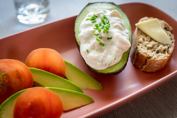 Vegetarian dish with tomato and avocado