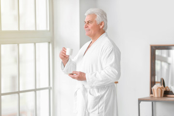 Morning of mature man in bathroom