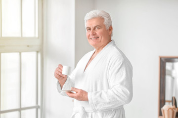 Morning of mature man in bathroom