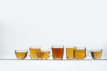 glass cups with hot tea on table, close view    