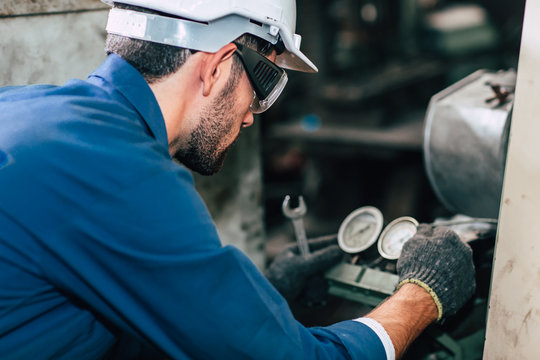 Machine repair fixing pressure gauge of machine in factory need to service and check.