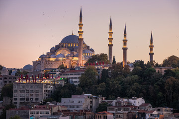 Fototapeta na wymiar Historic Suleymaniye Mosque Illuminated Vibrantly on a Hill in Istanbul's Old City at Dusk - Istanbul, Turkey