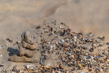 Zen concept. Object made of stone on the beach. Stone pyramid for meditation. Harmony and Meditation. Zen stones.