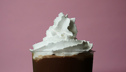 Close up Cocoa smoothie Topped Whip cream on pink background, Food concept Front view..