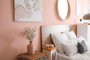 Fototapeta na wymiar Interior of beautiful modern bedroom with spring flowers