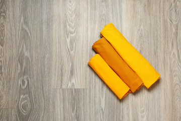 Stylish t-shirts on wooden background