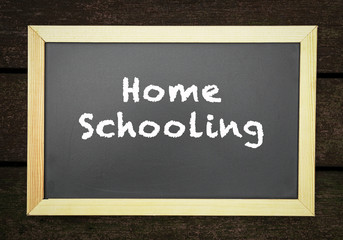 Homeschooling. Words or typed text on blackboard.