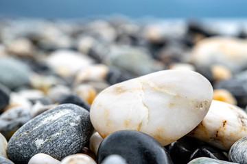 Fototapeta na wymiar Smooth Colorful Rocks on Beach (Texture/ Nature Background) 