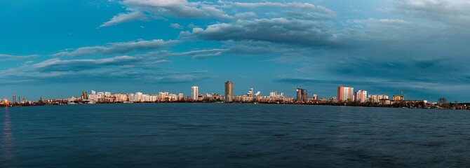 Panoramic view of Yekaterinburg city skyline from the waterfront after sunset