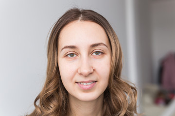 Naklejka premium Face of a beautiful young girl with a clean fresh face close up.