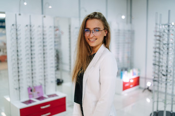 Woman in spectacles. Eyesight correction. Girl wearing glasses. Portrait of a woman in correcting glasses. Closeup.