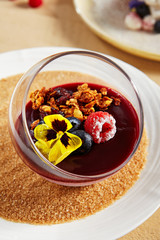 Berry Panna Cotta with Currant-Cointreau jelly in glass bowl