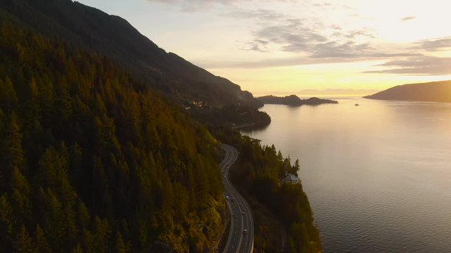 Sea to Sky Hwy in Howe Sound near Horseshoe Bay, West Vancouver, British Columbia, Canada. Aerial panoramic view during a colorful sunset in Fall Season.
