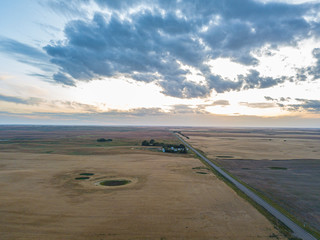 sunset aerial footage drone photography of road and fields in saskatchewan Canada Hazlet during sunset in summer fields after harvesting 