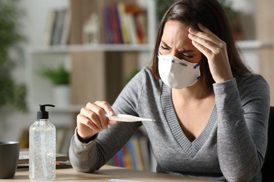 Sick woman suffering coronavirus symptoms at home