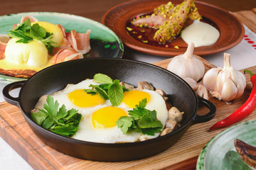 Fried egg with green spinach in pan, healthy breakfast. Healthy food.