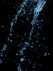 jet of water with splashes on a black background
