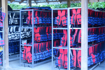 blue and red vests inside a hut