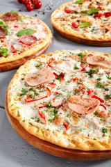 Meat pizza on wooden board