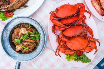 Many bright red steamed sea crabs Lined in a plate ready to serve for those who like to eat seafood, Chanthaburi, Thailand.