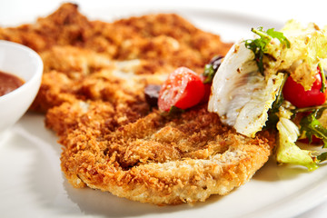 Meat chop in crispy breading close up