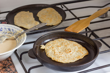 Pita bread in pan on plate. Dough on plate. Homemade bread.