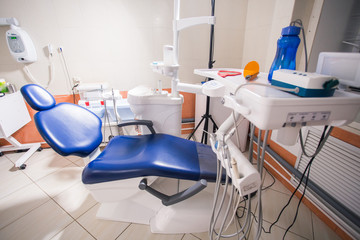 Dentist tools and professional dentistry chair waiting to be used by orthodontist
