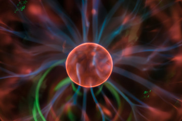 An abstract image of chaotically moving blue lightnings around an orange circle. No focus. Cosmic...
